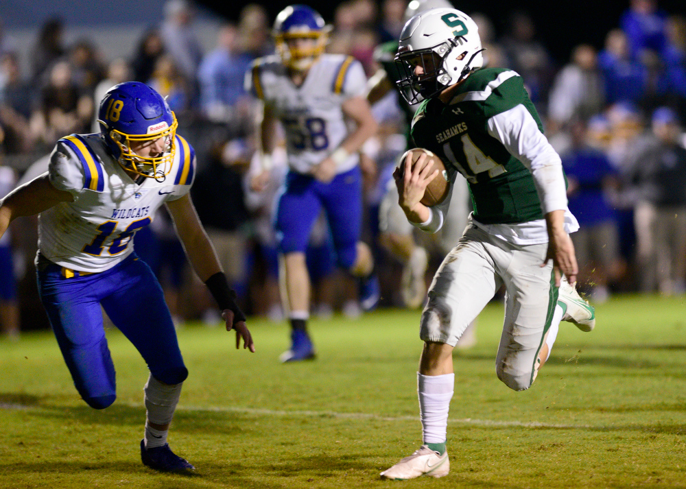 Staff Photo by Robin Rudd / Silverdale quarterback Brett Rogers (14) runs for the third Seahawk touchdown. The Silverdale Academy Seahawks hosted the Donelson Christian Academy Bobcats in TSSAA football on September 24, 2021.