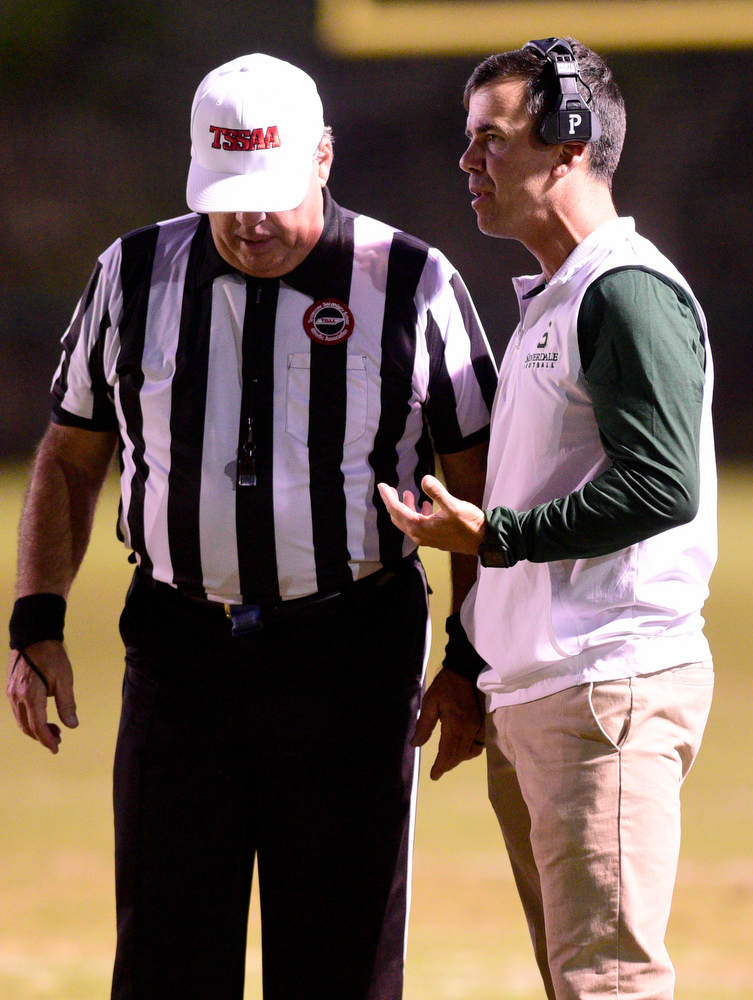 Staff Photo by Robin Rudd / Silverdale head coach Mike Connor discusses a call with the referee. The Silverdale Academy Seahawks hosted the Donelson Christian Academy Bobcats in TSSAA football on September 24, 2021.