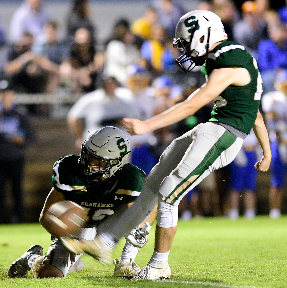 Staff Photo by Robin Rudd / Silverdale's Reid Jewell (26) kicks a extra point for the hold of Cameron Mullins (10). The Silverdale Academy Seahawks hosted the Donelson Christian Academy Bobcats in TSSAA football on September 24, 2021.