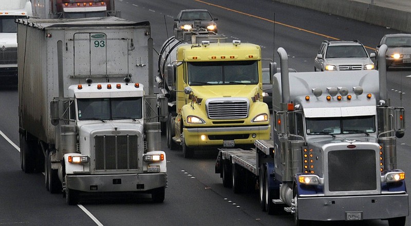 FILE —11 In this Dec. 17, 2010 file photo, trucks make their way eastbound, in Livermore, Calif. (AP Photo/Ben Margot, File)


