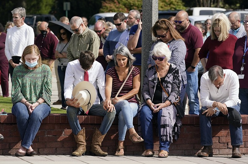 People pray during a vigil at the Collierville Town Hall, Friday, Sept. 24, 2021, in Collierville, Tenn. (AP Photo/Mark Humphrey)


