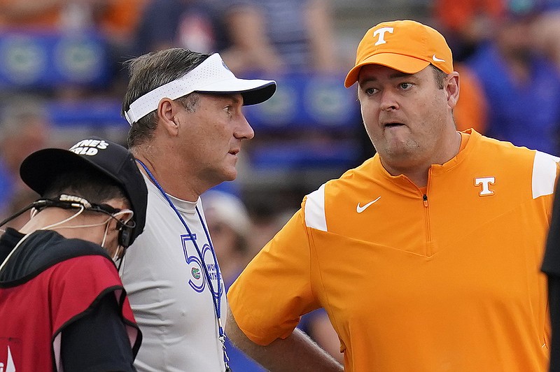 AP photo by John Raoux / Florida football coach Dan Mullen, left, and Tennessee counterpart Josh Heupel greet each other before Saturday night's game in Gainesville, Fla.