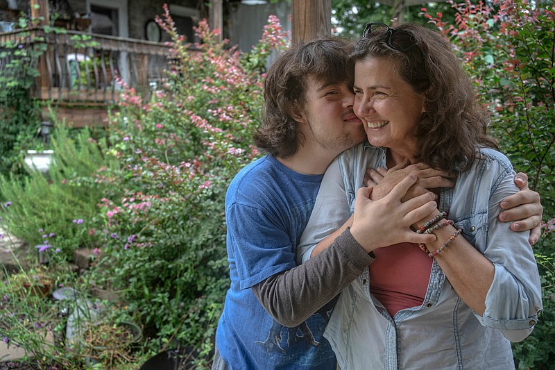 Photo by John Partipilo / Joey Doherty hugs his mom, Tommi Stephenson, in the backyard of their Nashville home.