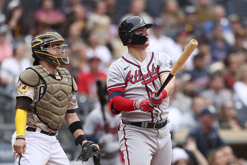 AP photo by Derrick Tuskan / The Atlanta Braves' Joc Pederson, right, watches his solo homer as San Diego Padres catcher Victor Caratini looks on during the second inning of Sunday's game in San Diego.