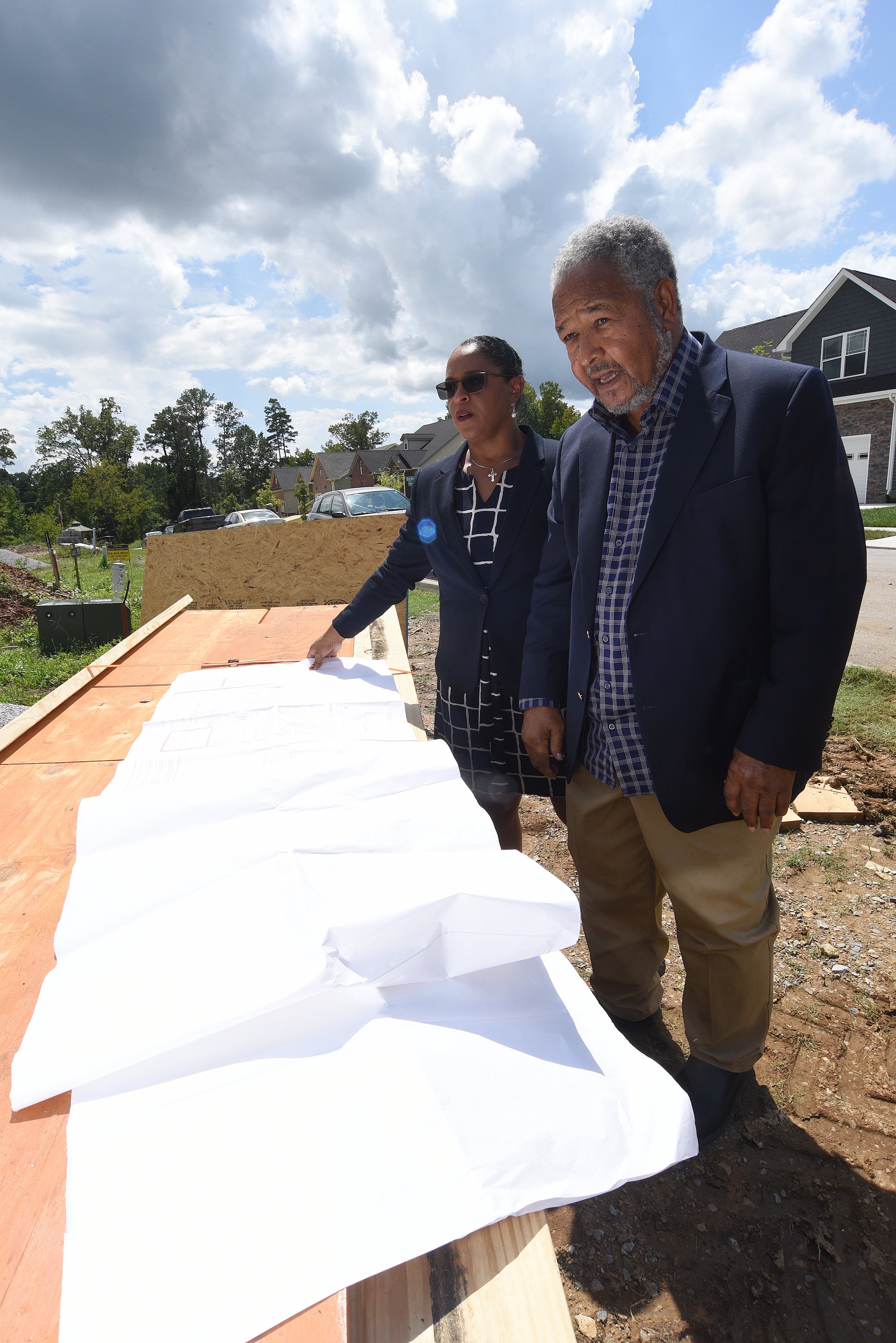 Staff Photo by Matt Hamilton / Bobby Joe Adamson and Brenda Jean Adamson, left, look over house plans at Mapp Estates in August.