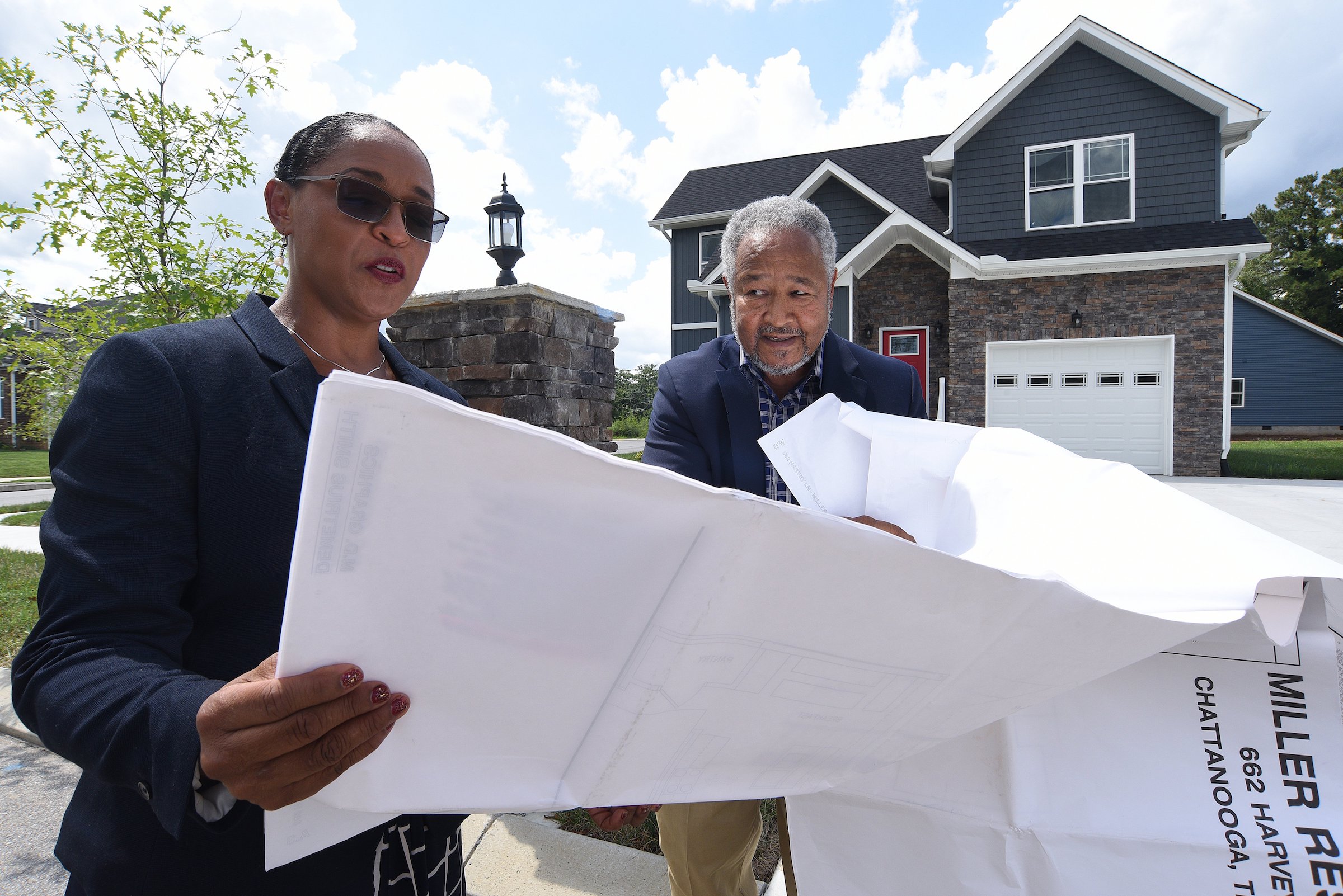 Staff Photo by Matt Hamilton / Bobby Joe Adamson and Brenda Jean Adamson, left, look over house plans at Mapp Estates in August.