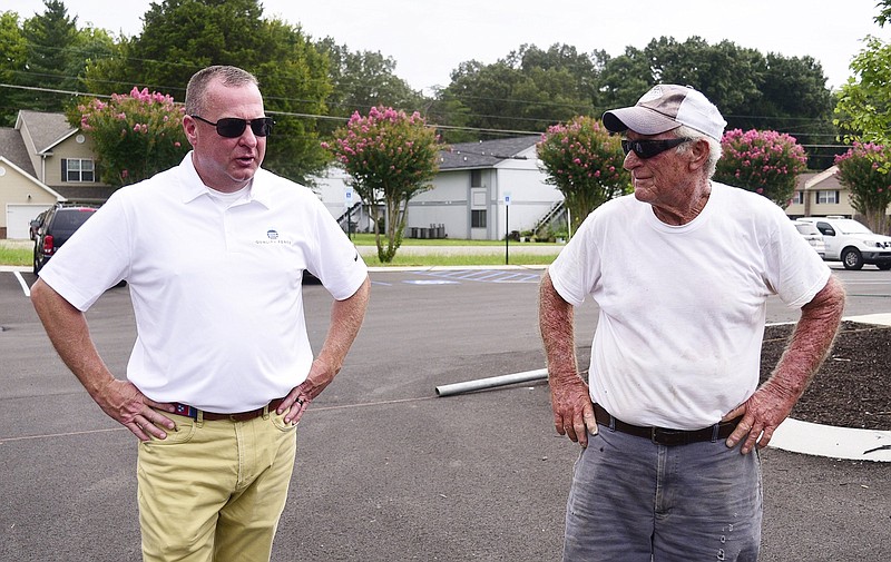 Staff Photo by Robin Rudd / Quality Fence Company co-owner Bobby Winnie, left, talks about his plans for the company while Rondell Robinson listens. Bobby Winnie and his business partner recently bought Quality Fence from Wendell Robinson, who built the business from scratch over 40 years. Wendell's brother, Rondell, who is 78 and still building fences. He say he'll never quit.