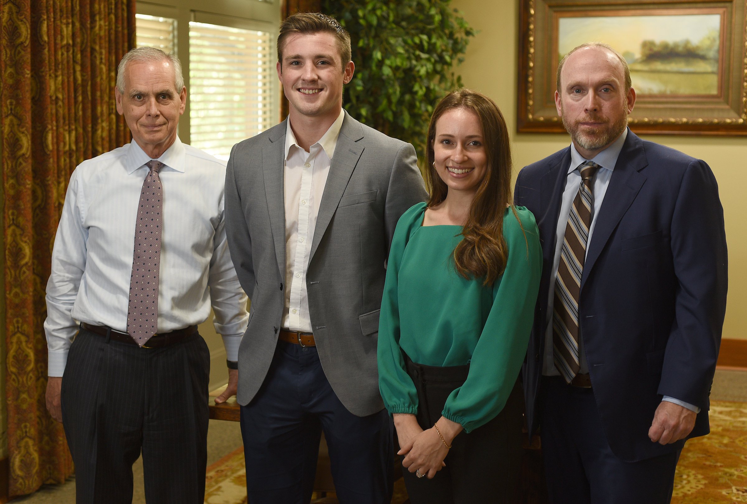 Staff Photo by Matt Hamilton / From left, Donnie Hutcherson, Zach Kanady, Chelsea O'Shields and Travis Horton at HHM CPAs in Chattanooga on Thursday, August 12, 2021.