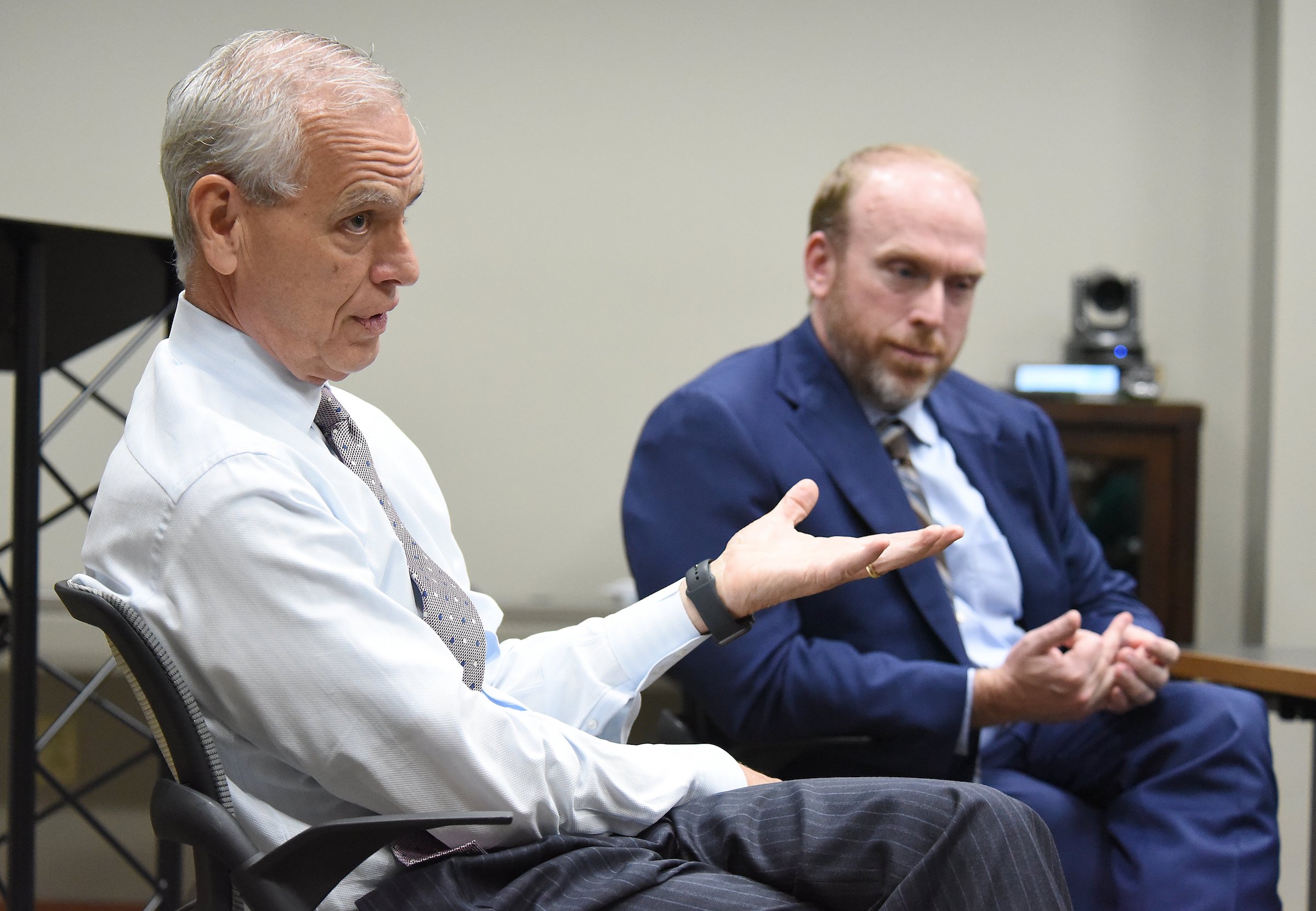 Staff Photo by Matt Hamilton / Donnie Hutcherson, left, and Travis Horton speak during a meeting at HHM CPAs in Chattanooga on Thursday, August 12, 2021.