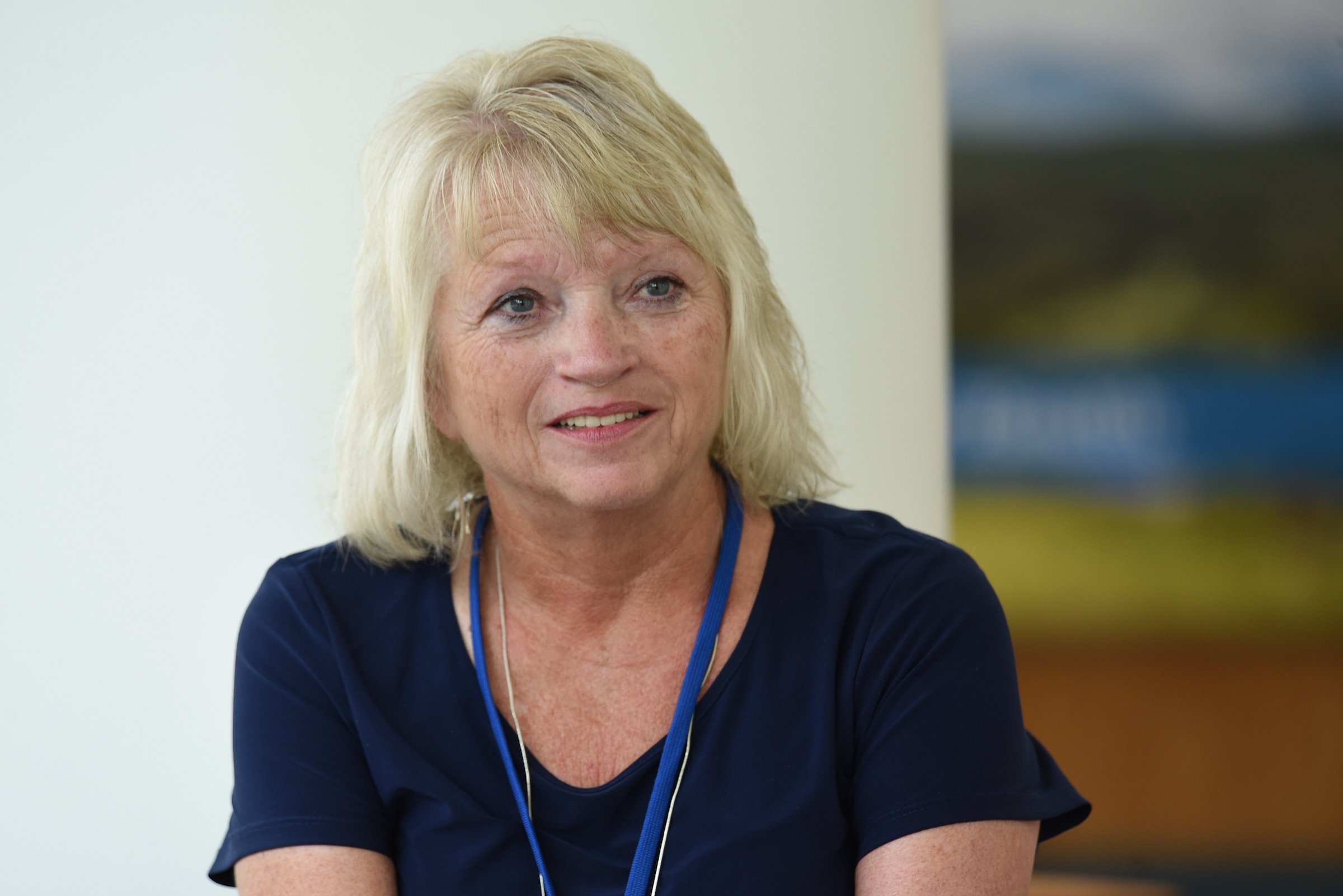 Staff Photo by Matt Hamilton / Sandy Owen talks with coworkers at BlueCross BlueShield Headquarters in Chattanooga on Friday, August 27, 2021.