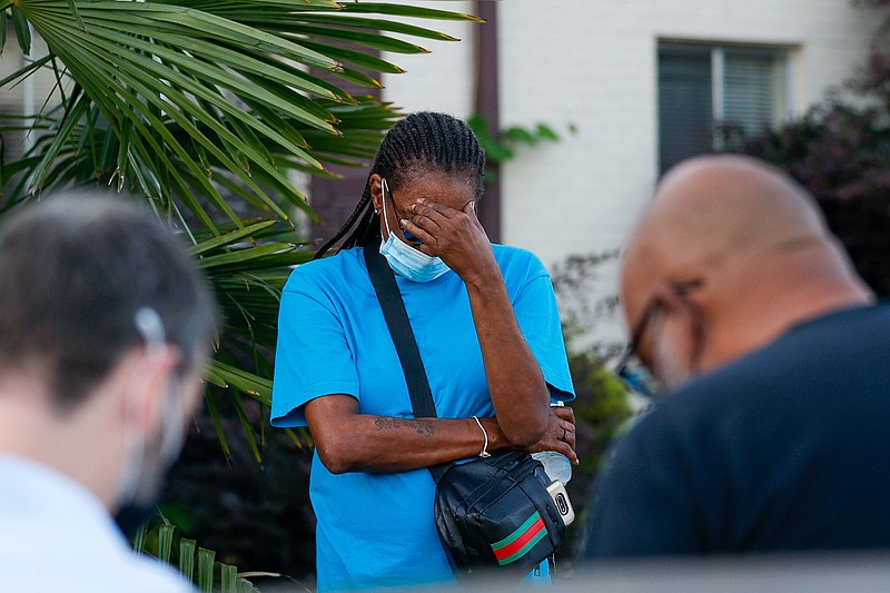 Staff photo by Troy Stolt / A Hamilton County resident gets emotional during a moment of silence that took place Monday, Sept. 27, 2021, in Chattanooga, Tenn., as part of a community action walk on the Westside meant to prevent more lives from being lost following multiple shootings over the weekend.