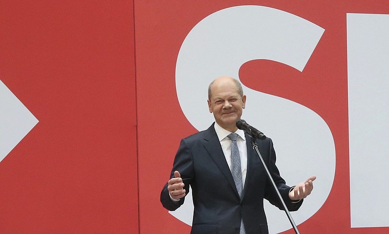 Social Democratic candidate for chancellor Olaf Scholz speaks at the party's headquarters in Berlin, Monday, Sept. 27, 2021. Following Sunday's election leaders of the German parties were meeting Monday to digest a result that saw Merkel's Union bloc slump to its worst-ever result in a national election and appeared to put the keys to power in the hands of two opposition parties. Both Social Democrat Olaf Scholz and Armin Laschet, the candidate of Merkel's party, laid a claim to leading the next government. (Wolfgang Kumm/dpa via AP)