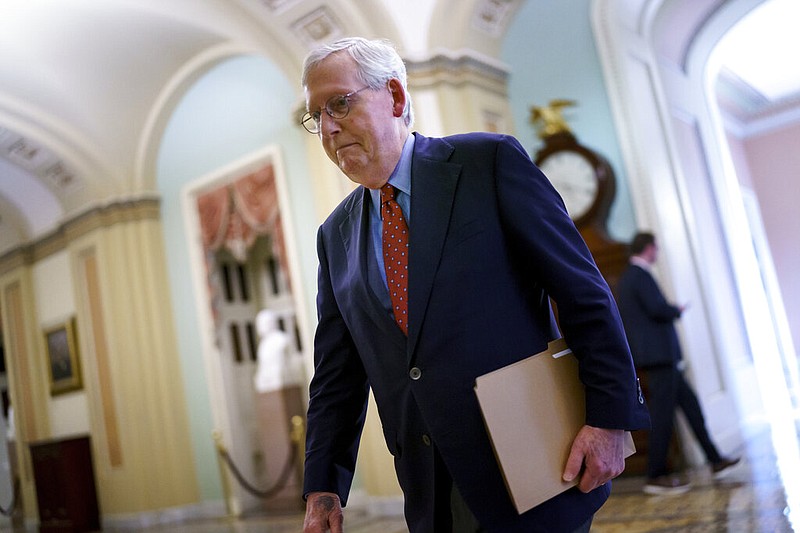 Senate Minority Leader Mitch McConnell, R-Ky., walks to the chamber for a test vote on a government spending bill, at the Capitol in Washington, Monday, Sept. 27, 2021. (AP Photo/J. Scott Applewhite)