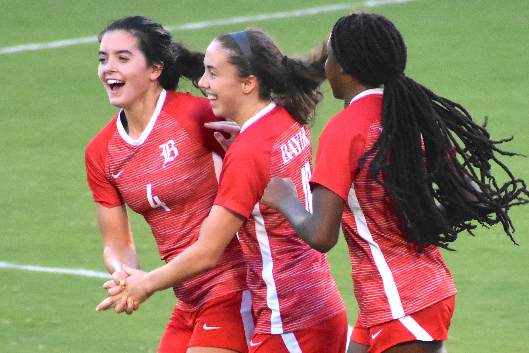 Staff photo by Patrick MacCoon / Baylor soccer players celebrate a goal against Notre Dame at home on Tuesday. Players from left, Ellie Carico, Claire Holtzclaw and Aliya Cooper.