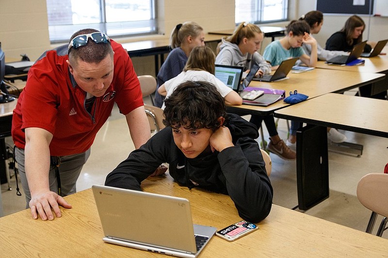 Staff file photo / Teacher Joshua Payne, left, works with Ty Harper as he completes a Learning Blade exercise in a seventh-grade STEM innovators class at Signal Mountain Middle High School on Thursday, May 9, 2019, in Signal Mountain, Tenn. Learning Blade presented a 3D printer to the school for their achievement using the Learning Blade program.