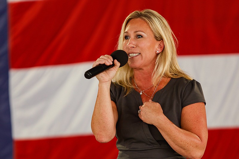 Staff photo by Troy Stolt / U.S. Rep. Marjorie Taylor Greene makes a speech during the 17th annual Floyd County GOP Rally at the Coosa Valley Fairgrounds on Saturday, Aug. 7, 2021, in Rome, Georgia.