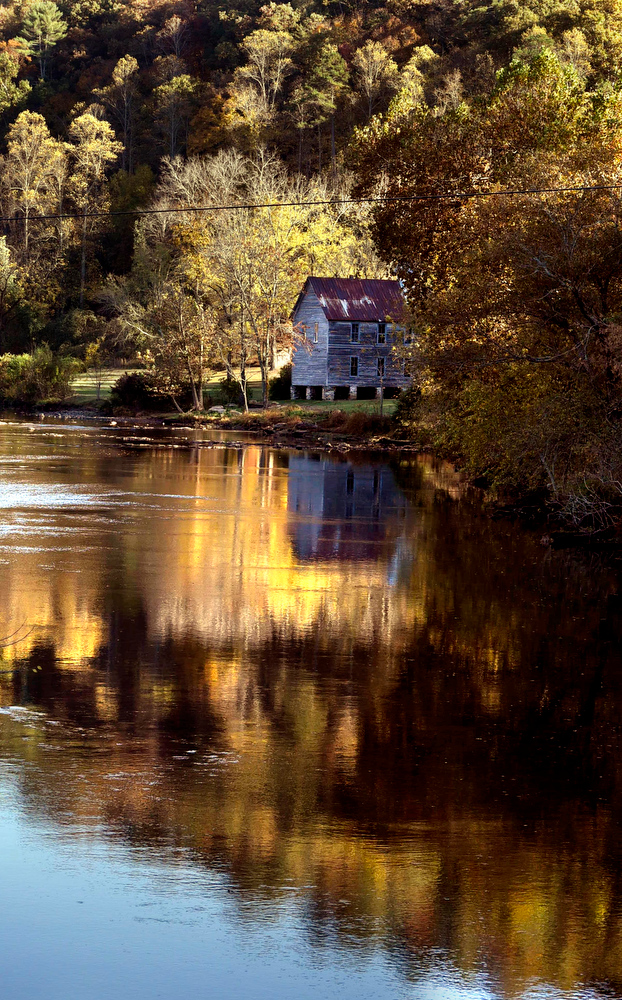 Staff Photo by Robin Rudd The The Hiwassee Union Baptist Church, built in 1899, and the colors of fall foliage reflect in waters of the Hiwassee River upstream from Reliance, Tennessee on October 30, 2016.