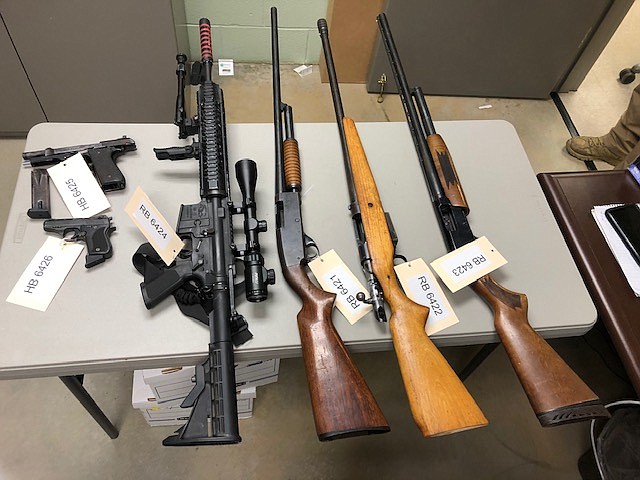 Photo contributed by the Grundy County Sheriff's Office / Guns seized in Dickinson-Rollins search and arrests.