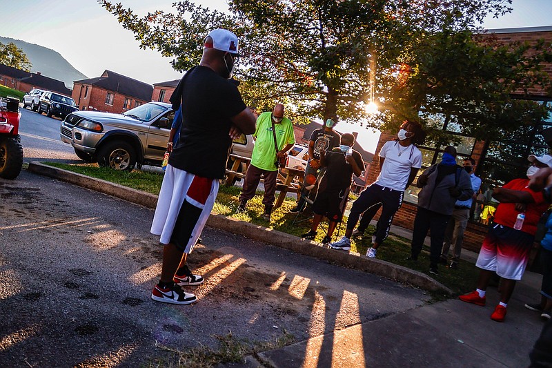 Staff photo by Troy Stolt / Chattanooga Activist Ladarius Price speaks during a Community Action Walk in the Westside meant to prevent more lives from being lost following multiple shootings in Chattanooga over the weekend.