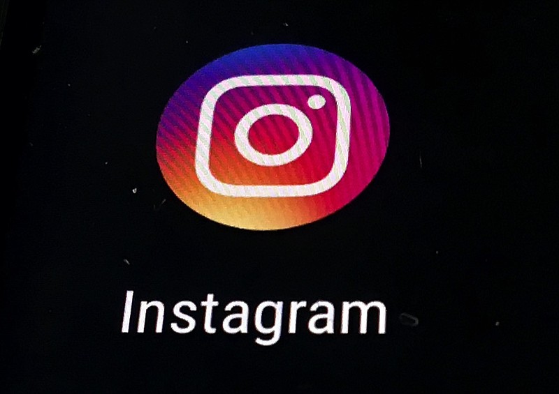 FILE - In this Nov. 29, 2018, file photo, the Instagram app logo is displayed on a mobile screen in Los Angeles. (AP Photo/Damian Dovarganes, File)


