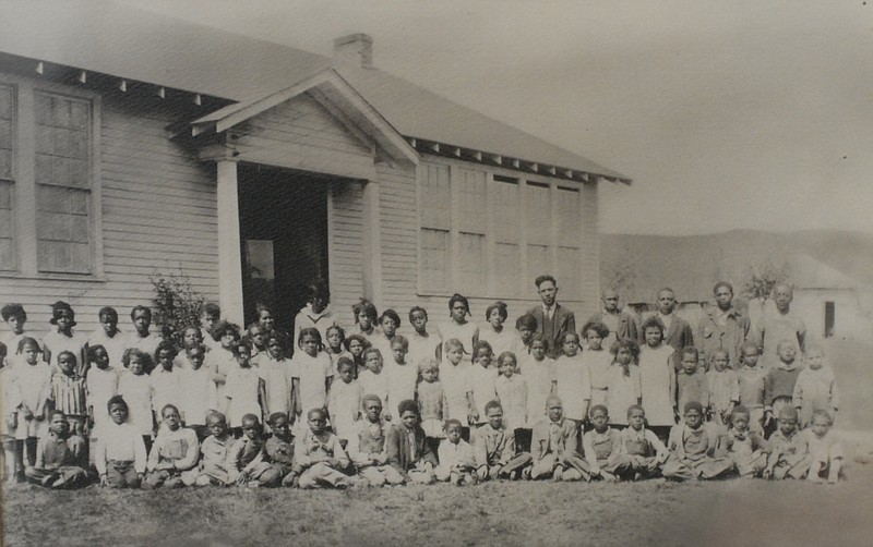 Staff file photo of a photo print / Lincoln School students pose for a group portrait in front of the Pikeville school in this undated photograph.