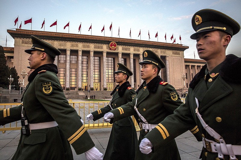 New York Times photo by Bryan Denton / Chinese soldiers march in front of the Great Hall of the People, before the opening of the National People's Congress in Beijing of 2018.