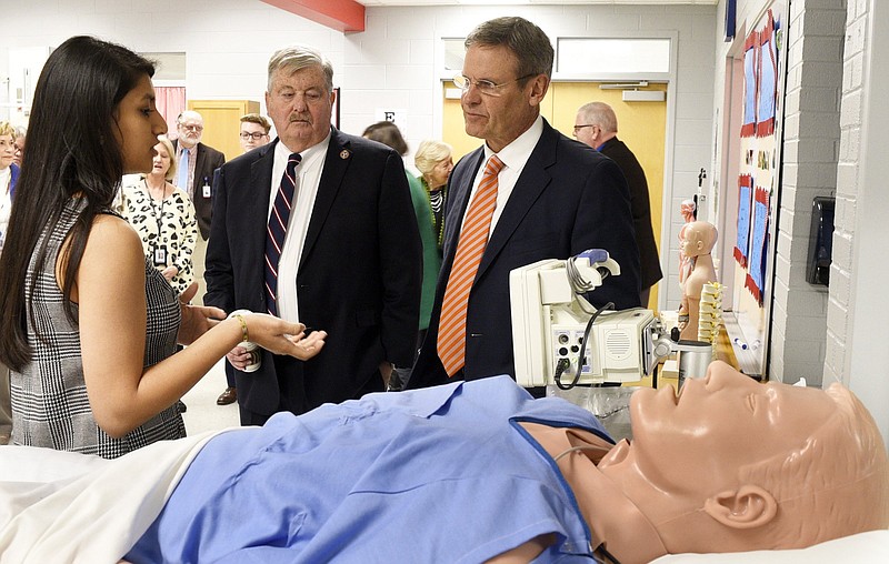 Staff Photo by Robin Rudd/   From left, Cleveland High Senior Siddhi Patel explains to the use of a manikin to study heart rhythms to Lieutenant Governor Randy McNally and Governor Bill Lee.  Tennessee Governor Bill Lee toured Cleveland High School to see the work teachers and students are doing to prepare students for career, college, and life readiness on January 7, 2020.