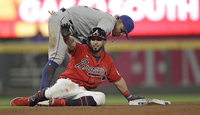 AP photo by Ben Margot / The Atlanta Braves' Eddie Rosario celebrates after hitting a double in the eighth inning of Friday night's home game against the New York Mets.