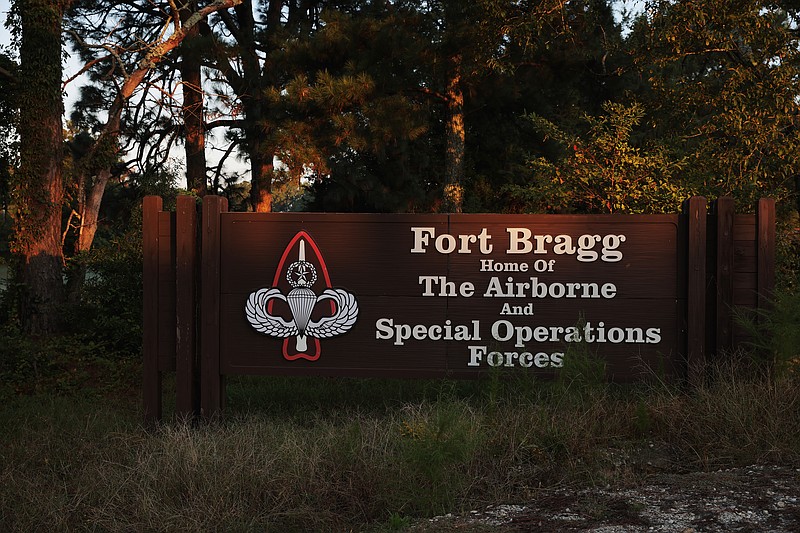 A sign on the perimeter of Fort Bragg in Fayetteville, N.C. Sept. 29, 2021. Fort Bragg, which is home to the storied 82nd Airborne Division and the Special Forces, is also central to the identity of a region in the shadows of the research triangle to the north. (Travis Dove/The New York Times)