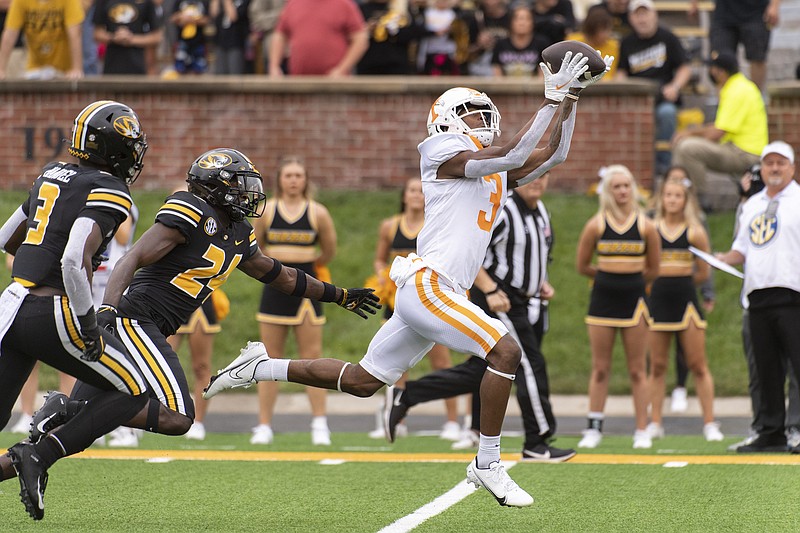 AP photo by L.G. Patterson / Tennessee wide receiver JaVonta Payton, right, catches a touchdown pass in front of Missouri's Allie Green IV, center, and Martez Manuel during the first half of Saturday's SEC matchup in Columbia, Mo.