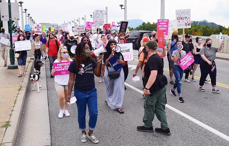 Staff Photo by Robin Rudd / Abortion rights activists gathered at Renaissance Park before marching across the Walnut Street Bridge and returning via the Market Street Bridge on Saturday, Oct. 2, 2021. The march crosses the Market Street Bridge before concluding at Renaissance Park.