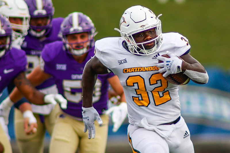 Staff photo by Troy Stolt / UTC's Ailym Ford runs the ball during Saturday's SoCon opener against Western Carolina at Finley Stadium. Ford had a 54-yard touchdown run on a day of big plays for the Mocs, who won 45-17 to even their overall record at 2-2.