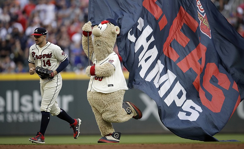 AP photo by Ben Margot / Atlanta Braves mascot Blooper follows outfielder Adam Duvall off the field at the end of Sunday's home game against the New York Mets. The Braves beat New York 5-0 to close the regular season, and they'll begin an NL Division Series against the Milwaukee Brewers on Friday.