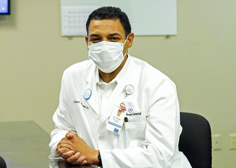 Dr. Vincent Shaw poses for a portrait in Baton Rouge, La., Wednesday, Sept. 29, 2021. He commonly hears patients tell him they haven't done enough research on the COVID-19 vaccines. Rest assured, he tells them, the vaccine developers have done their homework. (AP Photo/Dorthy Ray)