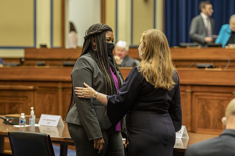 Photo by Jason Andrew of The New York Times / Rep. Cori Bush, D-Mo., left, waits to speak during a House Committee on Oversight and Reform hearing in Washington on Thursday, Sept. 30, 2021, where she testified about being raped as a teenager and her subsequent abortion.