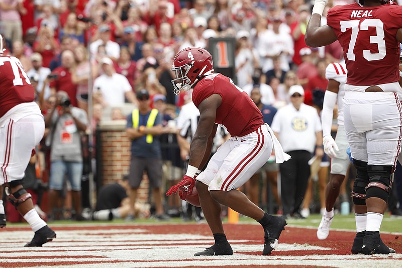 Crimson Tide photos / Alabama fifth-year senior running back Brian Robinson Jr. scored a pair of first-half touchdowns to stake the Crimson Tide to a 28-0 halftime lead in their eventual 42-21 win over Ole Miss.