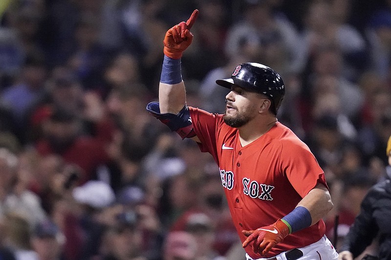 Boston Red Sox's Kyle Schwarber celebrates his solo homer in the third inning of an American League Wild Card playoff baseball game against the New York Yankees at Fenway Park, Tuesday, Oct. 5, 2021, in Boston. (AP Photo/Charles Krupa)