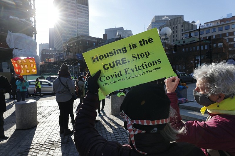 FILE - In this Jan. 13, 2021, file photo, tenants rights advocates demonstrate outside the Edward W. Brooke Courthouse in Boston. (AP Photo/Michael Dwyer, file)


