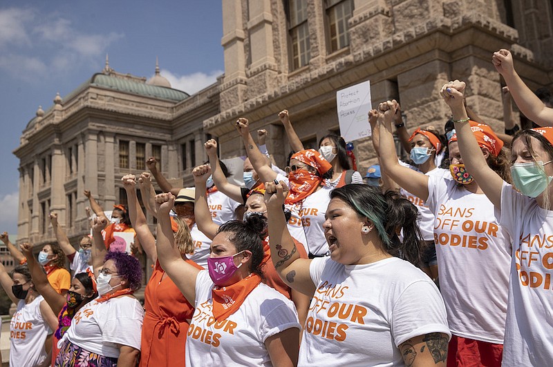 In this Sept. 1, 2021, file photo, women protest against the six-week abortion ban at the Capitol in Austin, Texas. A federal judge on Wednesday, Oct. 6 ordered Texas to suspend the most restrictive abortion law in the U.S., which since September has banned most abortions in the nation's second-most populous state. (Jay Janner/Austin American-Statesman via AP, File)