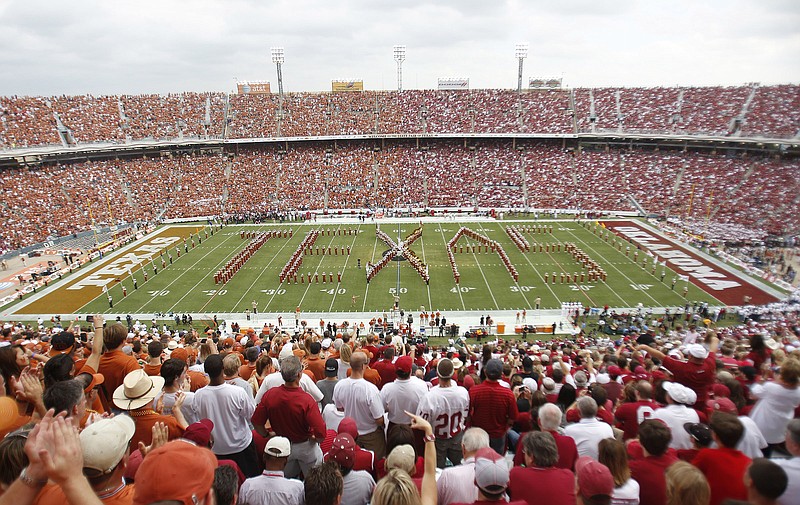 AP photo by Mike Fuentes / Texas fans, left, and Oklahoma fans, right, fill the Cotton Bowl for the annual Red River Showdown football game between the Longhorns and the rival Sooners on Oct. 8, 2011, in Dallas.