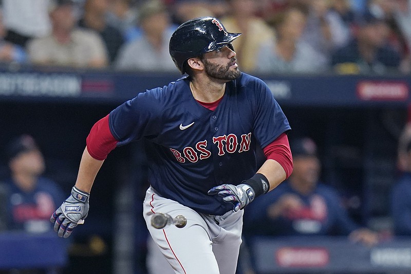 AP photo by Chris O'Meara / Boston's J.D. Martinez watches his three-run homer in the fifth inning of Friday night's AL Division Series matchup with the Tampa Bay Rays in St. Petersburg, Fla. The Red Sox rallied to win 14-6.