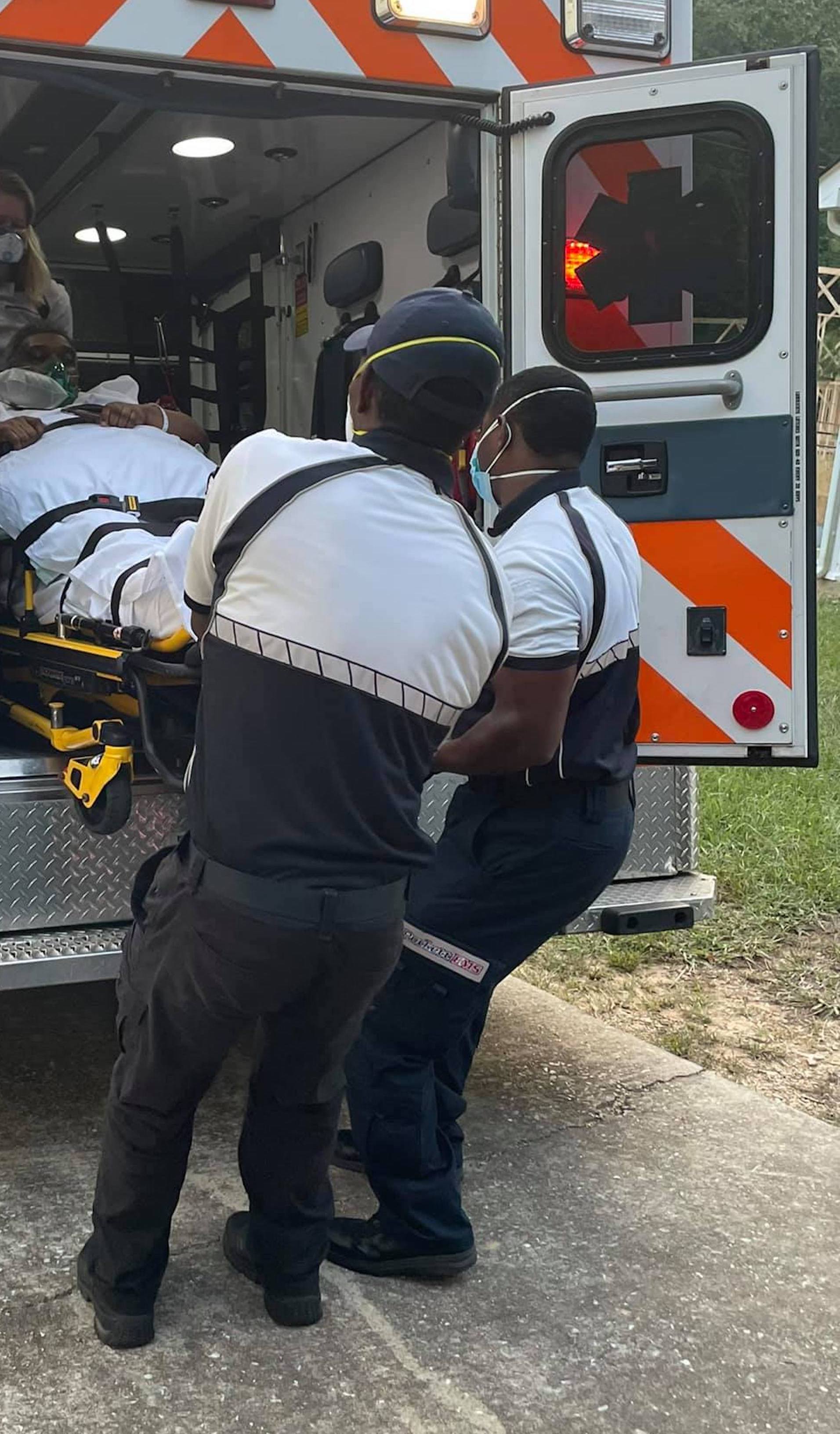 Contributed photo by Patrick Hampton / Marlon Hampton, 49, is moved from an ambulance to a residential home in early October. The Hampton's decided to treat Marlon's COVID-19 infection at home instead of continuing to receive treatment at a local hospital.
