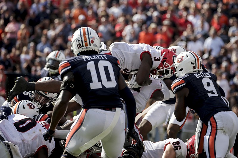 AP photo by Butch Dill / Georgia running back Zamir White (3) dives in for a touchdown during the first half of Saturday's SEC matchup at Auburn in the Deep South's Oldest Rivalry.
