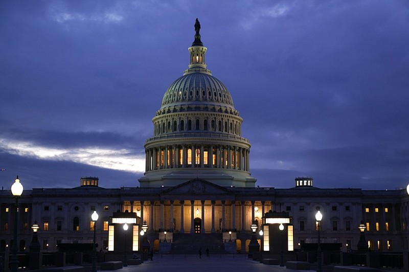 In this Oct. 6, 2021, photo, the light in the cupola of the Capitol Dome is illuminated, indicating that work continues in Congress, in Washington. (AP Photo/J. Scott Applewhite)


