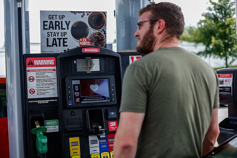 Staff photo by Troy Stolt / "I don't know anyone who wants to pay more for gas. It's sorta a bipartisan thing," Ben Michaels said as he put gas in his car at the Speedway gas station on the corner of South Holtzclaw Avenue and E. Third Street on Monday.