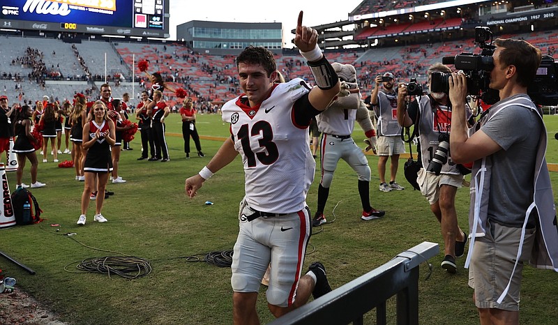 Georgia photo by Tony Walsh / Georgia quarterback Stetson Bennett leaves the field at Auburn's Jordan-Hare Stadium after leading the Bulldogs to a 34-10 win this past Saturday.