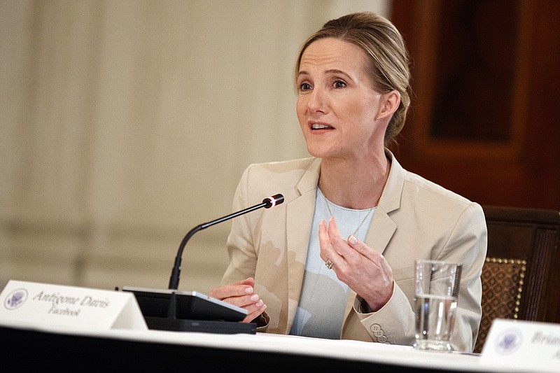 FILE - In this March 20, 2018 file photo, Facebook's head of global safety policy Antigone Davis speaks during a roundtable on cyberbullying with first lady Melania Trump, in the State Dining Room of the White House in Washington. Facebook will expand its policies on harassment to remove more harmful content, the company said Wednesday, Oct. 13, 2021 in its latest change following congressional testimony from a whistleblower who faulted the social media giant for not doing enough to stop harmful content. "We do not allow bullying and harassment on our platform, but when it does happen, we act," Antigone Davis, Facebook's head of global safety, wrote in a blog post.(AP Photo/Evan Vucci, File)