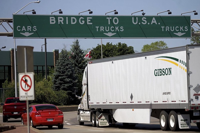 In this Friday June 15, 2012 file photo, Motorists make their way to Ambassador Bridge connecting Canada to the United States in Windsor, Ontario. The U.S. will reopen its land borders to nonessential travel next month, ending a 19-month freeze due to the COVID-19 pandemic as the country moves to require all international visitors to be vaccinated against the coronavirus. The new rules, to be announced Wednesday, Oct. 13, 2021 will allow fully vaccinated foreign nationals to enter the U.S. regardless of the reason for travel (Mark Spowart/The Canadian Press via AP, File)