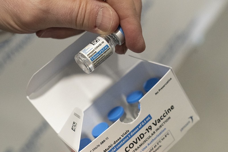 FILE - In this Wednesday, March 3, 2021 file photo, a pharmacist holds a vial of the Johnson & Johnson COVID-19 vaccine at a hospital in Bay Shore, N.Y. (AP Photo/Mark Lennihan)



