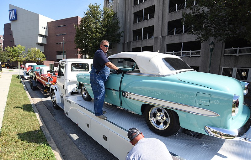 Staff Photo by Matt Hamilton / Steve Ashley of Bowling Green, Ky. gets into a 1954 Chevrolet BelAir to drive it off a trailer at the Chattanooga Convention Center on Thursday, Oct. 14, 2021.